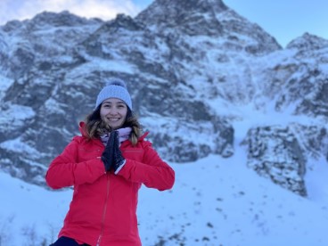 Photo of a girl in snowy mountains